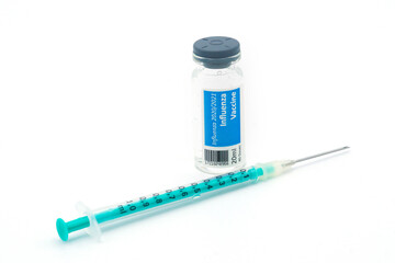 Influenza vaccination vial and a syringe with needle	
