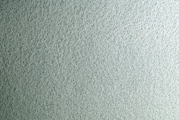 Seamless background in a grey tone. Seamless slightly gradiented texture