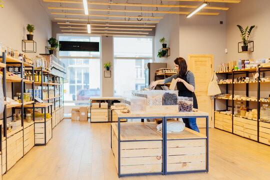 Zero Waste Shop Interior. Wooden Shelves With Different Food Goods And Personal Hygiene Or Cosmetics Products In Plastic Free Grocery Store. Eco-friendly Shopping At Local Small Businesses