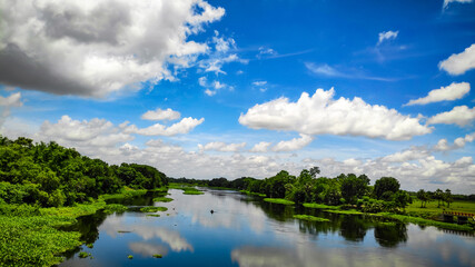 Fototapeta na wymiar clouds over the river