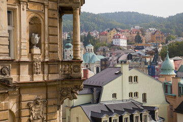 Cityscape of a European town on a hill. Buildings on multiple levels. Art nouveau architecture,...