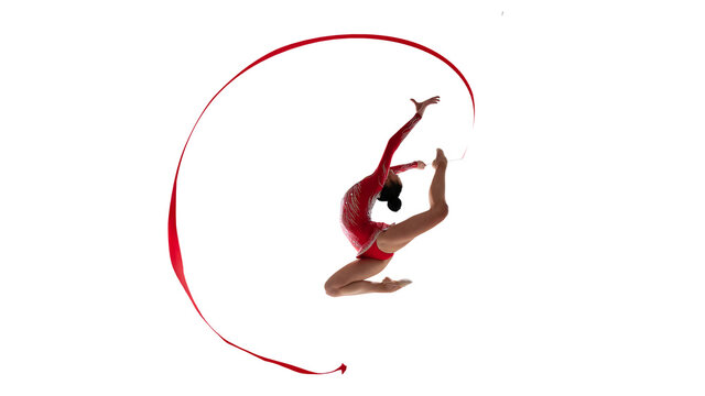 Rhythmic gymnast isoladed on white.