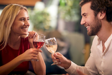 Cheerful couple on a romantic date together having a special moment