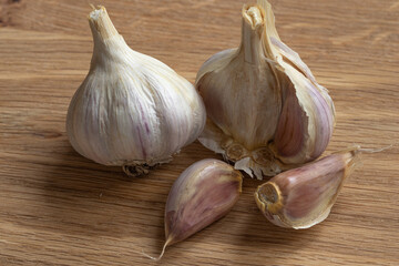 Whole garlic on the wooden background.