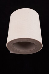 toilet paper on black background
