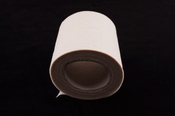 toilet paper on black background