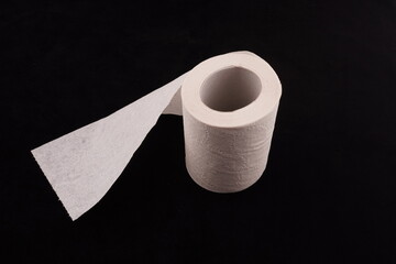 toilet paper on black background