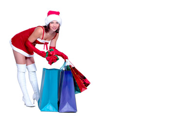 Woman in santa costume with shopping bags on white background, copy space, isolate