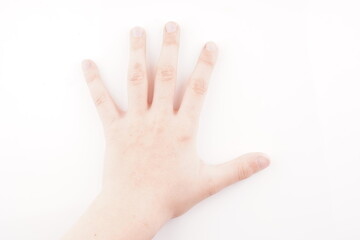 Obraz na płótnie Canvas hand of a child on a white background