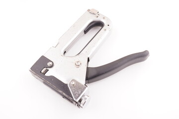 metal construction stapler on white background