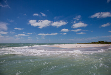 Sand beach with birds on the southern tip of Egmont Key State Park in the Gulf of Mexico on the west coast of  Florida