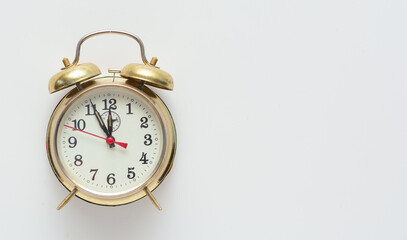 Vintage alarm clock on a white background. Concept - New Year. Copy space