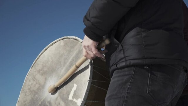 A man playing on the Ramadan drums