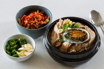 Ginseng chicken soup with abalone which is called Jeonbok Samgyetang