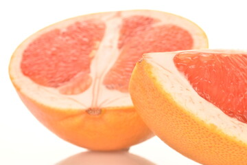 organic ripe grapefruits, close-up, isolated on white.