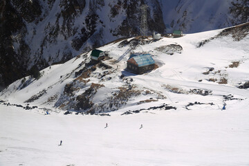 Fototapeta na wymiar View of the ski slope and service houses on the slope of Mount Elbrus, Elbrus region, Caucasus