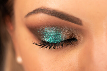 Close up of woman face with amazing make-up, eye with glitter shadows. Art, beauty industry,...
