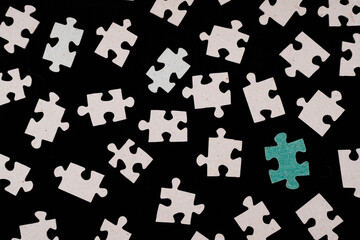 Naklejka premium puzzle on a black background