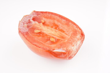 rotten tomato on white background