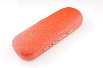 red glasses case on white background