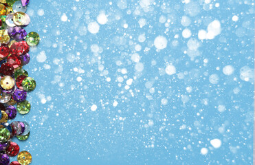 Fototapeta na wymiar Christmas blue background with sparkles and snow
