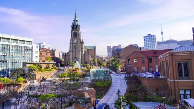 People climb the stairs of Myeongdong Cathedral in the daytime. Seoul City Center, South Korea