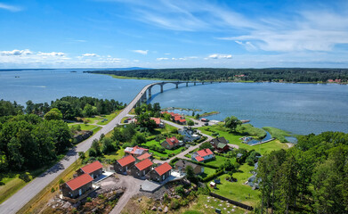 Coast village and bridge to Torso island on Vanern - aerial view