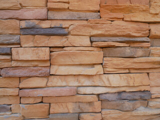 Slate brick in earth tone colour used as wall finishes. Installed overlap according to the method recommended by the manufacturer to get the maximum effect.