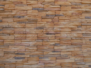 Slate brick in earth tone colour used as wall finishes. Installed overlap according to the method recommended by the manufacturer to get the maximum effect.