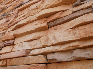 Slate brick in earth tone colour used as wall finishes. Installed overlap according to the method...