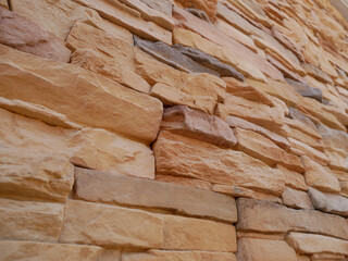 Slate brick in earth tone colour used as wall finishes. Installed overlap according to the method recommended by the manufacturer to get the maximum effect.
