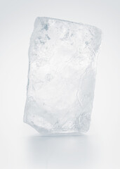 Textured pure rectangular ice block, isolated on white background.