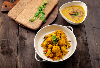 traditional indian meal lentil soup, flat bread and cauliflower vegetable, dal, roti and sabzi