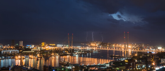 Fototapeta premium Lightning storm over night city.
