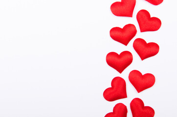 Nice red hearts on white background. Copy space, top view