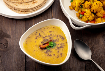 traditional indian meal lentil soup, flat bread and cauliflower vegetable, dal, roti and sabzi