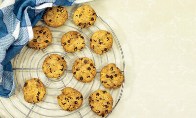 Chocolate Chip Cookies on grid with napkin on marble background