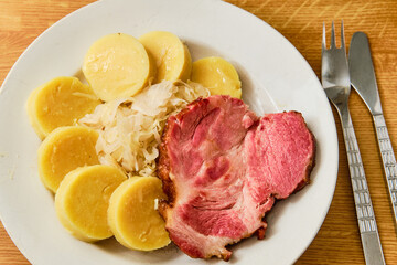 Smoked pork meat with dumpling and shredded cabbage