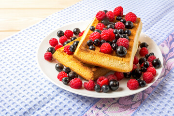 Belgian waffles with blueberry, raspberry and blackcurrant