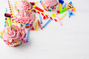 Fototapeta na wymiar Birthday background with cupcakes
