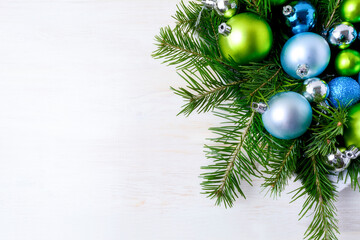 Christmas decorations fir branches, blue and green ornaments