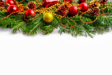 Christmas red ornaments and golden decorated pinecone, copy space