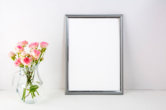 Placeit-Silver frame mockup with pink roses in glass
