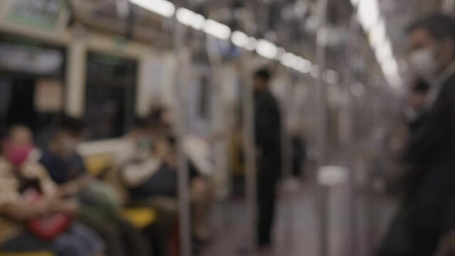 Blurred Many people are using train travel, mass transit. By wearing a face mask And  social distancing is to prevent Coronavirus. Concept new normal