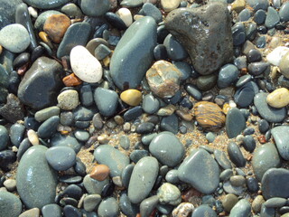 abstract background pebble stones by the sea