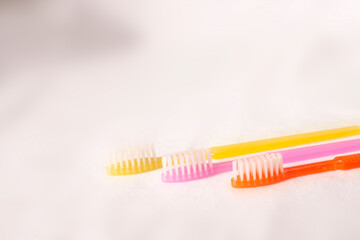 colorful toothbrushes on white background