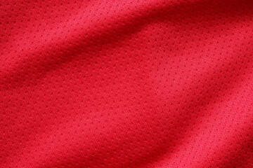 Red sports clothing fabric football shirt jersey texture close up
