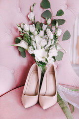 wedding bouquet of pink roses. pink shoes