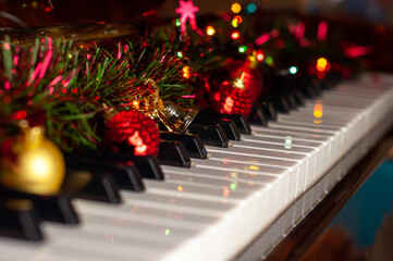 Keys of the instrument decorated with balls, the Concept of new year and Christmas