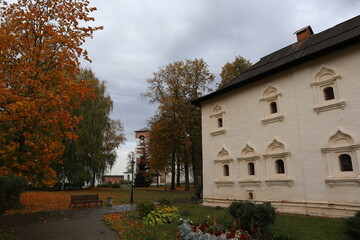 Beautiful old white building in autumn Park. Architecture, history and culture, autumn panorama of the garden. 